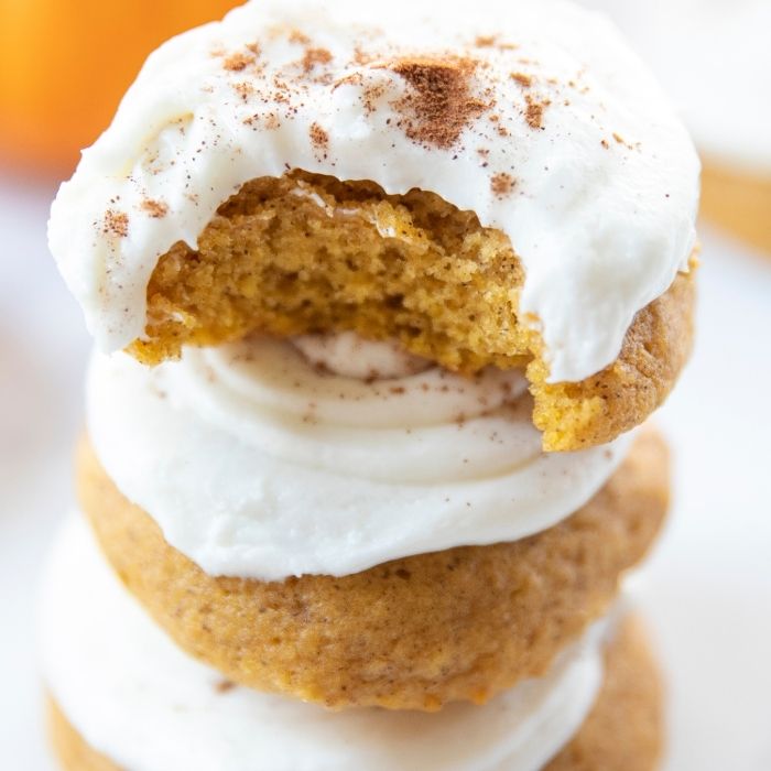 pumpkin cookies stacked on top of each other