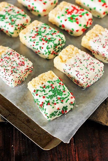 dipped white chocolate rice krispies on baking sheet 