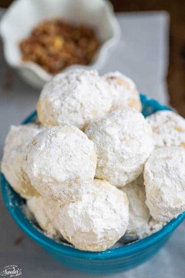 snowball cookies in a blue bowl 