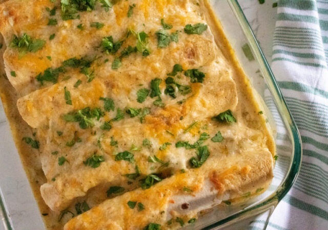 white chicken enchiladas in pan