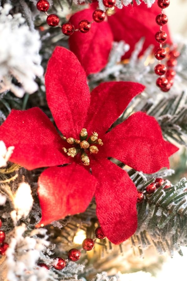 fake flowers on Christmas tree