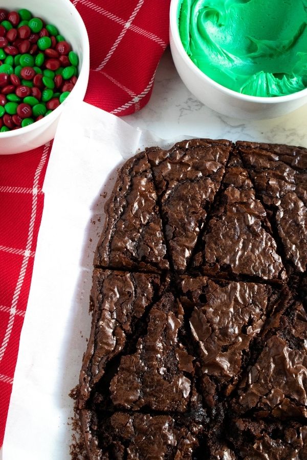 brownies cut out on parchment in shape of tree 