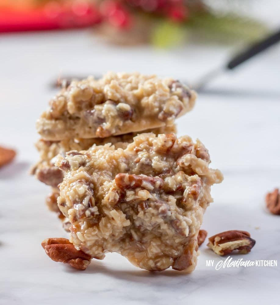praline cookies on a white table with christmas decor behind it 