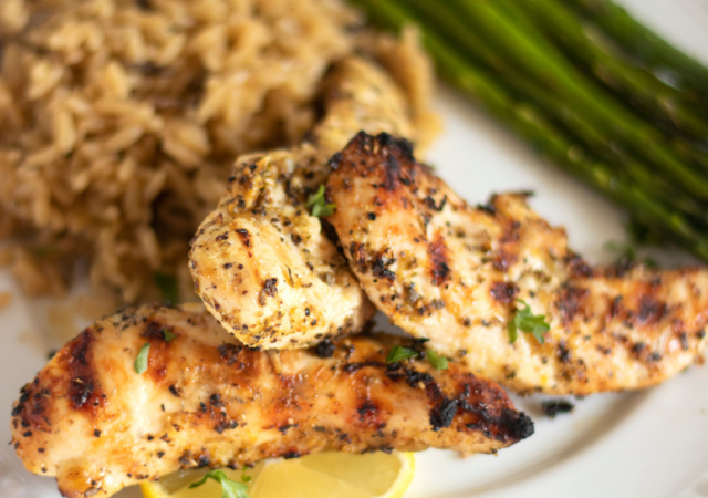 plate with lemon garlic chicken on a plate with vegetables