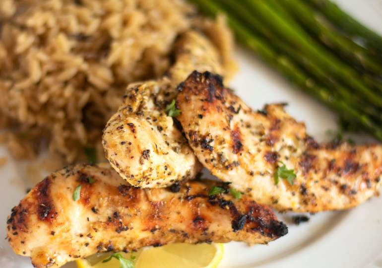 plate with lemon garlic chicken on a plate with vegetables