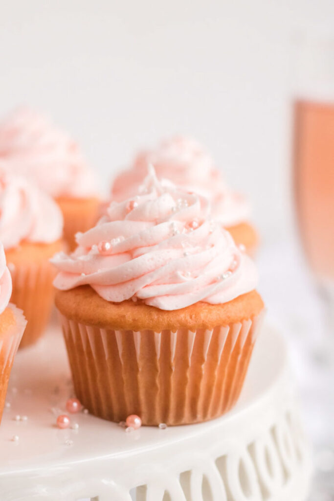 pink champagne cupcakes on table 