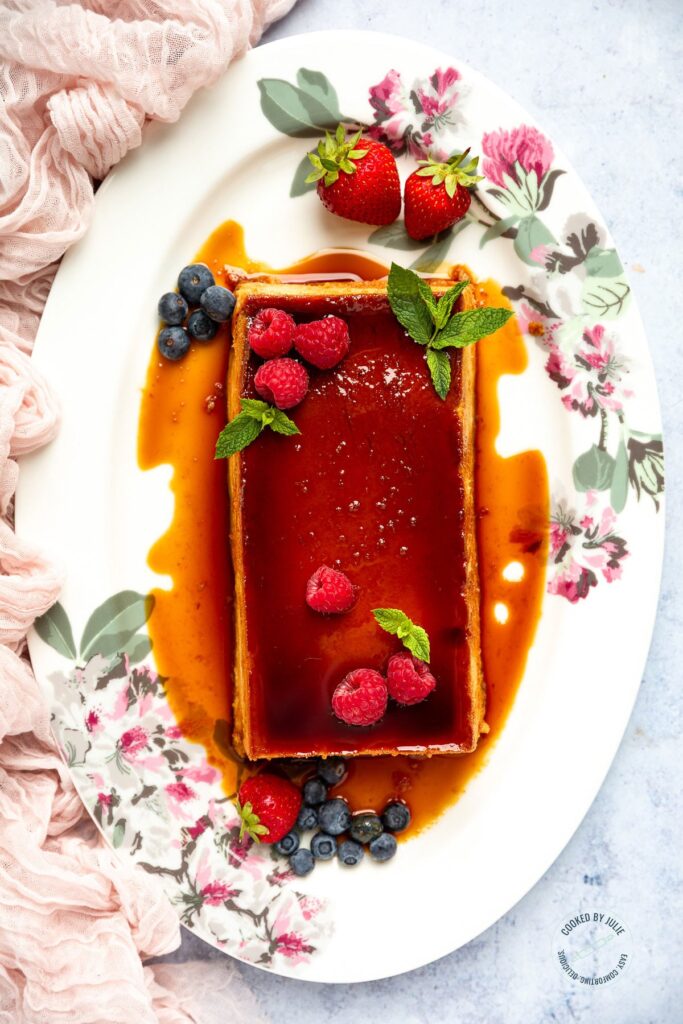 flan dessert on platter with berries 