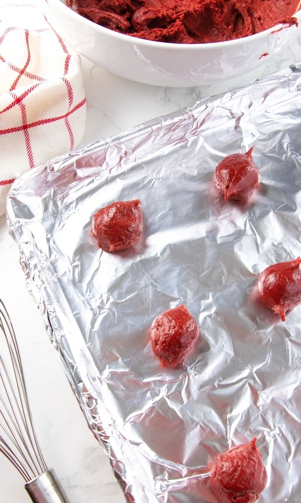 cookie dough on baking sheet with aluminum foil