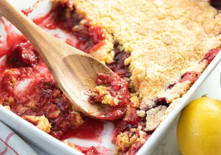 dump cake with wood spoon in pan