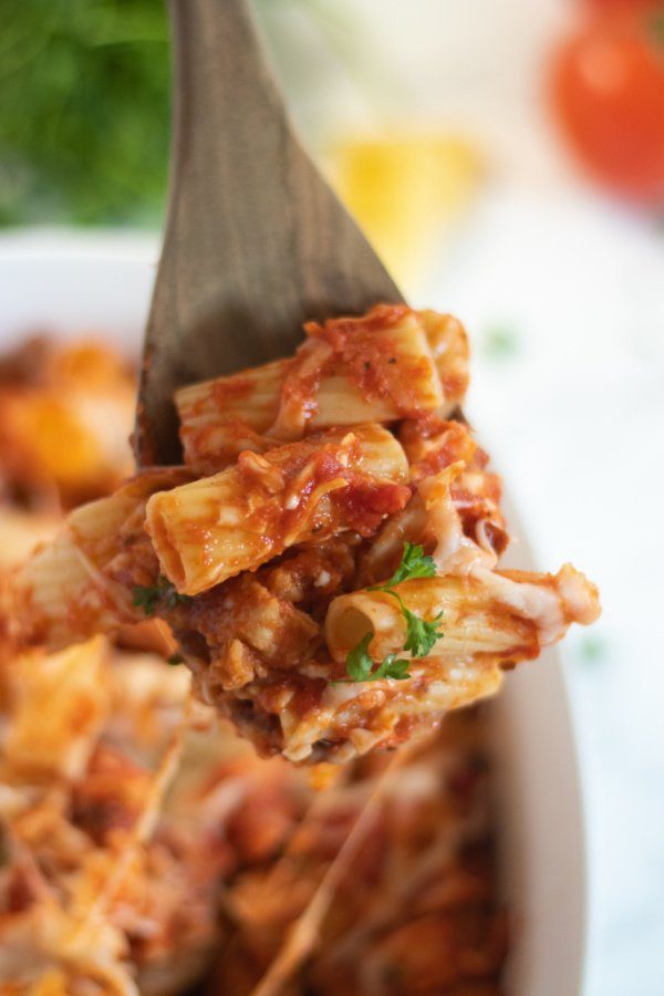 pasta casserole with some pasta on wooden spoon