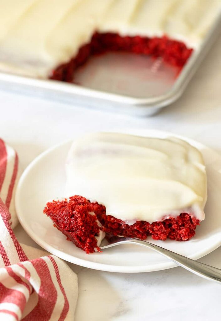 red velvet sheet pan cake on plate with fork