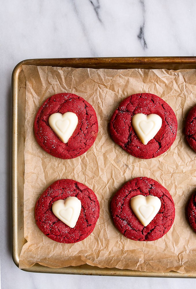 red velvet sugar cookies on cookie sheet pan