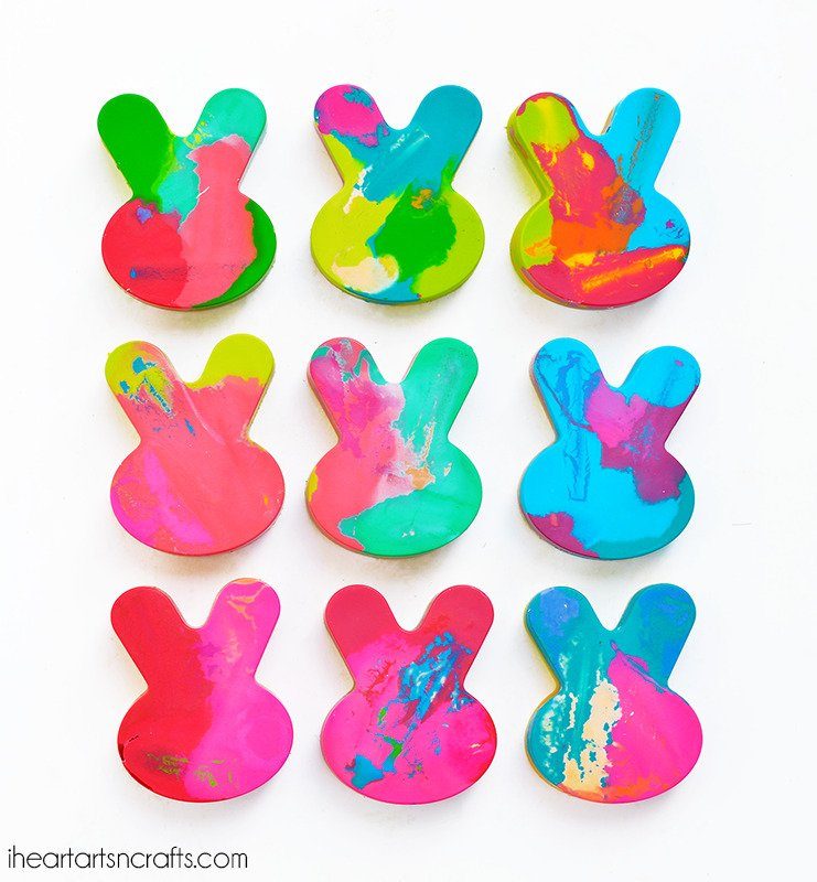 Easter bunny shaped crayons on table 