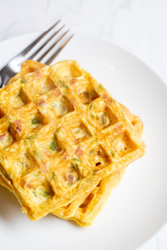 Check out these tasty recipes in waffle maker! From sweet to savory and all things in between. Whip up these for snacks, lunch or dinner. #passion4savings #waffle #wafflemaker #savory #sweet #dessert #best #easy Denver Omelet Waffle stacked on plate