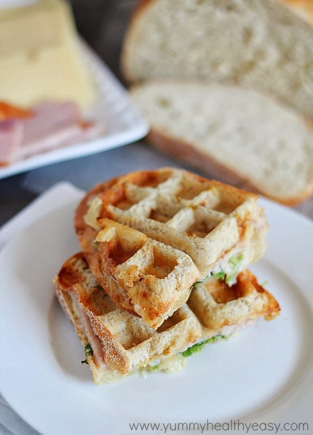 Check out these tasty recipes in waffle maker! From sweet to savory and all things in between. Whip up these for snacks, lunch or dinner. #passion4savings #waffle #wafflemaker #savory #sweet #dessert #best #easy turkey swiss sandwich on plate