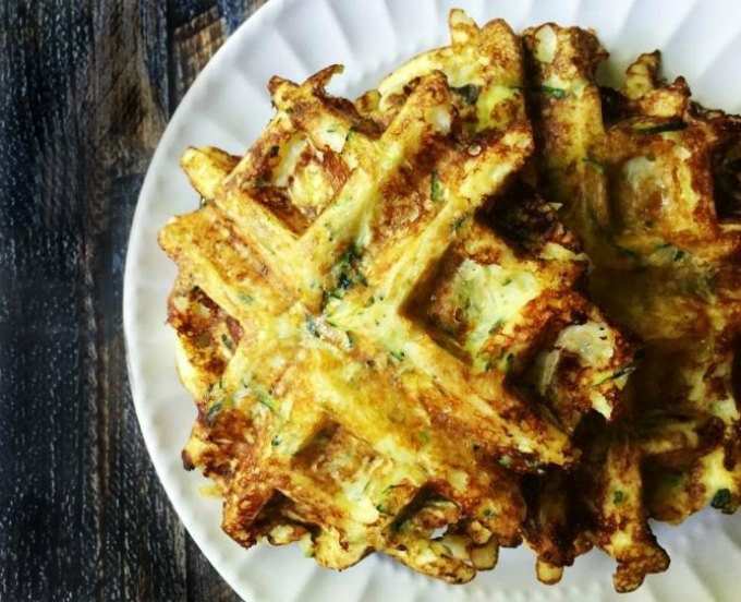 stack of zucchini waffles on a plate on table 