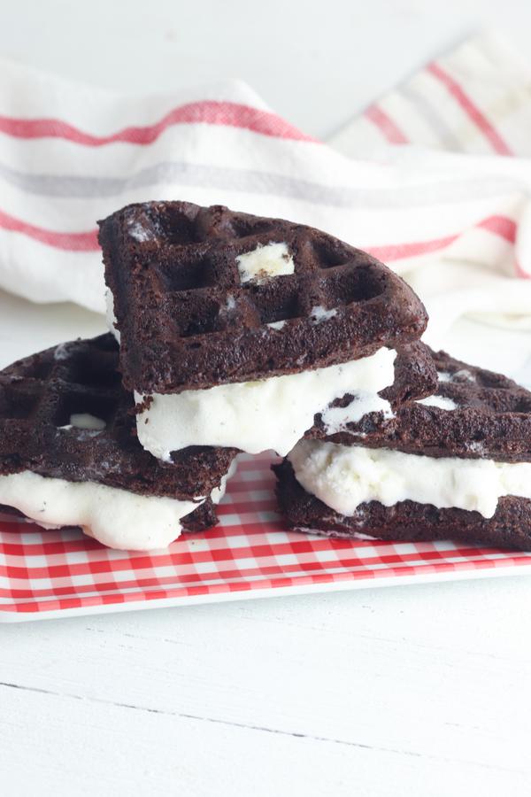 brownie waffle ice cream sandwiches on a red checked plate 