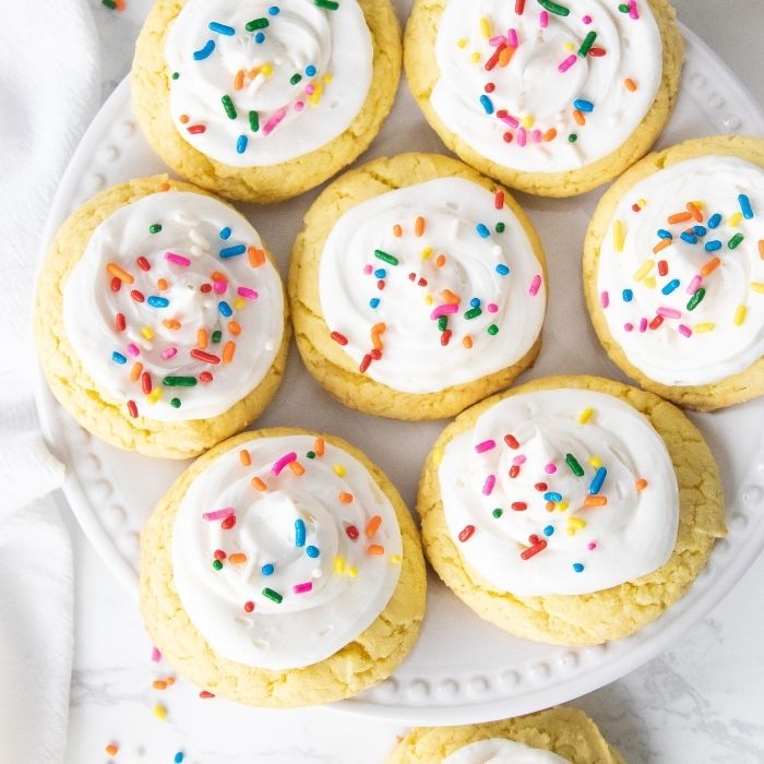 plate with frosted cookies on it 