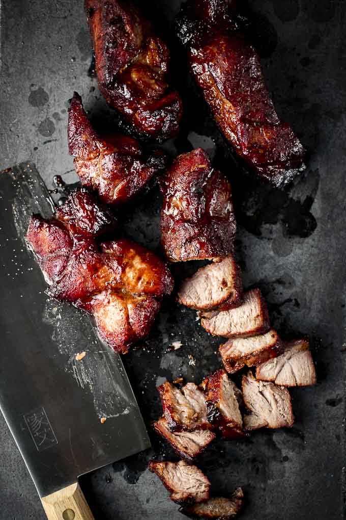 chinese bbq pork on black slate cutting board