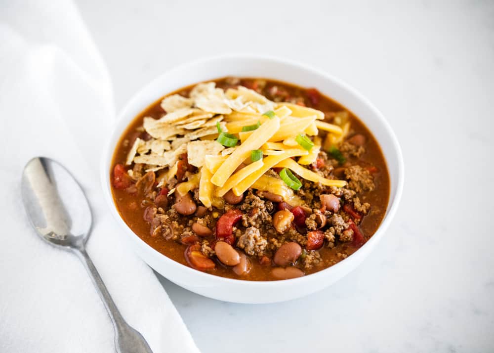 bowl of chili with cheese on top