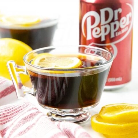 hot doctor pepper in clear mug with lemons by it