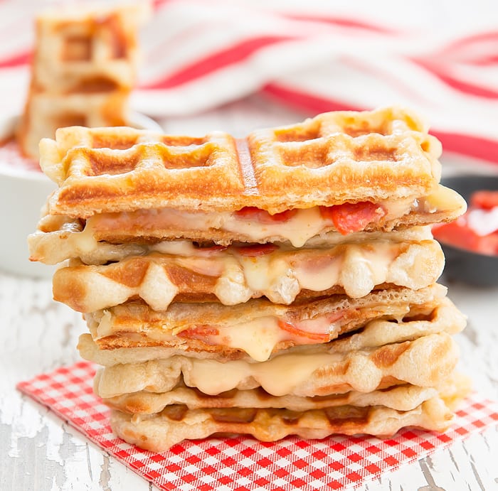 pizza grilled cheese stacked on top of each other 