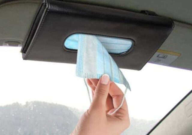 Car Sun Visor Mask Dispenser - taking mask out of dispenser