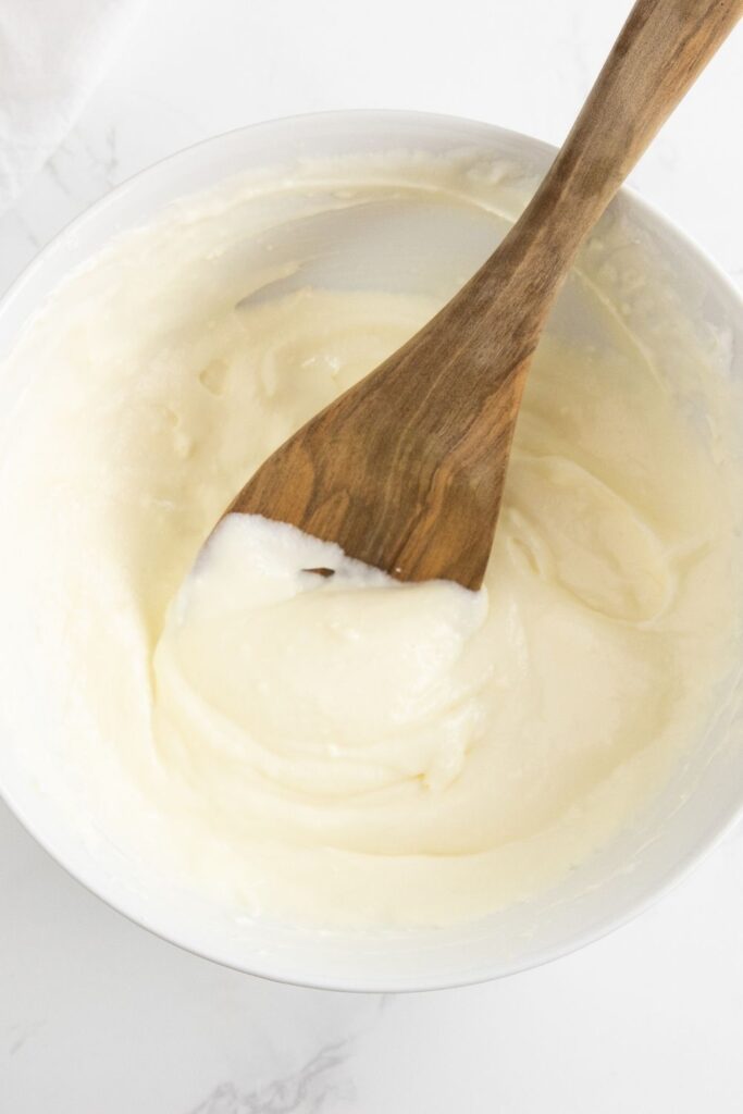 Whip up this easy and quick 3 ingredient lemonade fruit dip. Simple to make, and loaded with sweet citrus flavor in all you dip! #passion4savings #fruit #fruitdip #easy #quick #3ingredient #lemonade #creamcheese #marshmallowfluff #summer #spring #potluck #dessert cream cheese fruit dip in a bowl