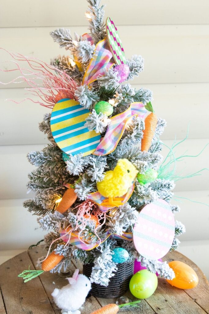 Check out this Dollar Tree Easter Tree! You will decorate an indoor tree with festive and fun Easter decor found at the Dollar Tree! #easter #passion4savings #tree #homedecor #dollartree #easy #affordable #budget #homedecor #best #dollarstore festive holiday tree for Easter