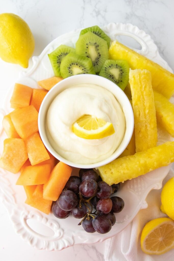 Whip up this easy and quick 3 ingredient lemonade fruit dip. Simple to make, and loaded with sweet citrus flavor in all you dip! #passion4savings #fruit #fruitdip #easy #quick #3ingredient #lemonade #creamcheese #marshmallowfluff #summer #spring #potluck #dessert simple lemonade fruit dip