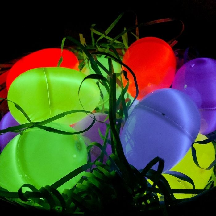 Check out this glow in the dark Easter egg hunt for kids and adults. Glow in the dark eggs that are fun to search for outside and indoors. #passion4savings #glowinthedark #easter #easteregg #egghunt #Easter light up easter eggs in a basket