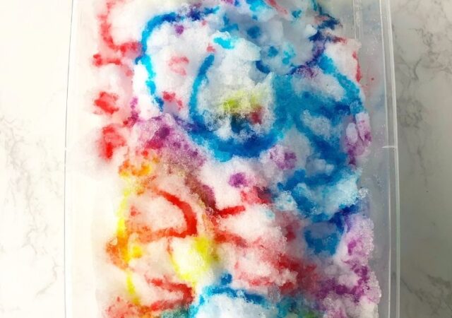 painted snow in a plastic container