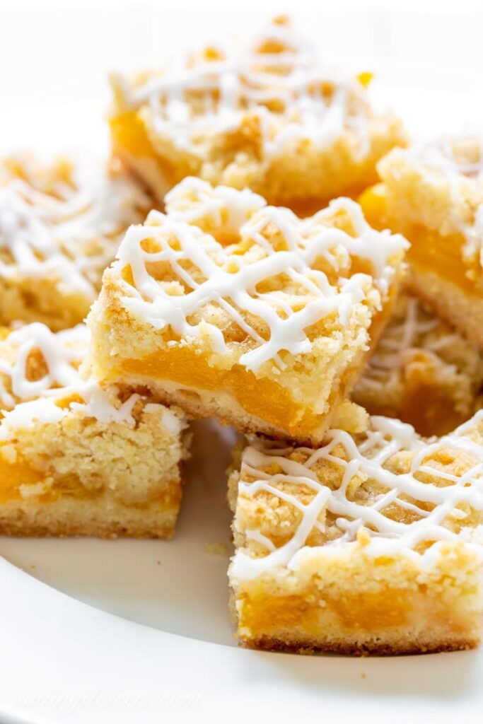 stacked crumb bars on a plate 