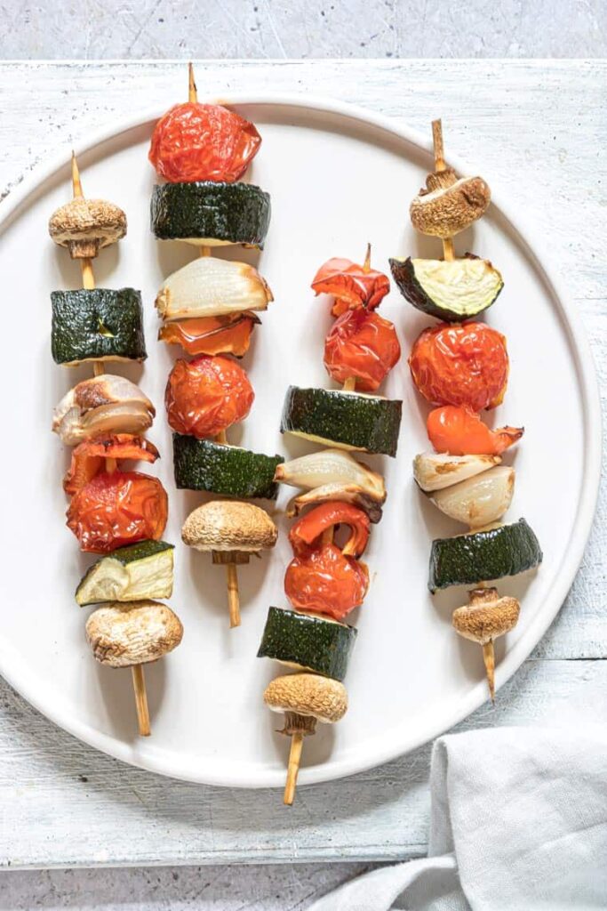 vegetable kabobs on a plate 