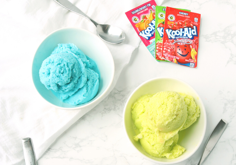 Kool Aid Ice cream in a bowl with kool aid packets around it 