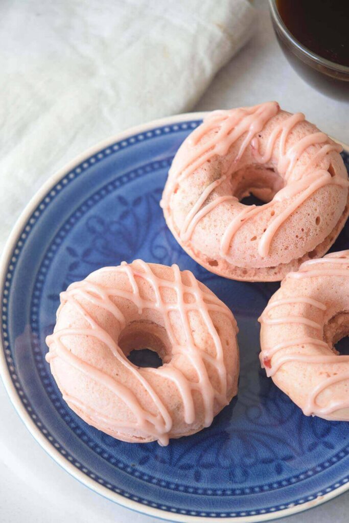 strawberry donuts on a plate 