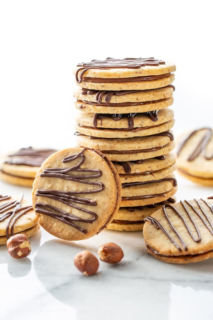 hazelnut sandwich cookies stacked on top of each other 