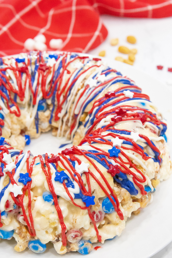 Serve up this delicious sweet patriotic popcorn cake for Memorial day or the 4th of July. An easy no bake dessert to make and serve up. #passion4savings #Popcorn #cake #Nobake #easy #best #homemade #marshmallow #dessert #fun #memorialday fourth of july dessert