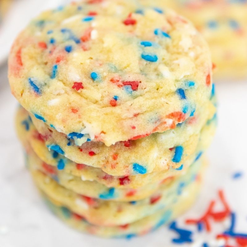 Here are delicious 4th of July Sprinkle Cookies for you to make and serve up for your 4th of July summer bash! Easy cookies, fun, and tasty. #passion4savings #sprinkles #4thofjuly #patriotic #dessert #summer #cookies cookies stacked on a plate