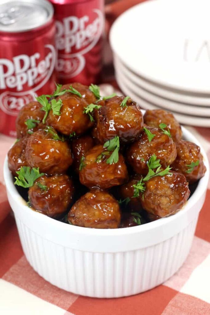 bowl of dr pepper meatballs with parsley on top 