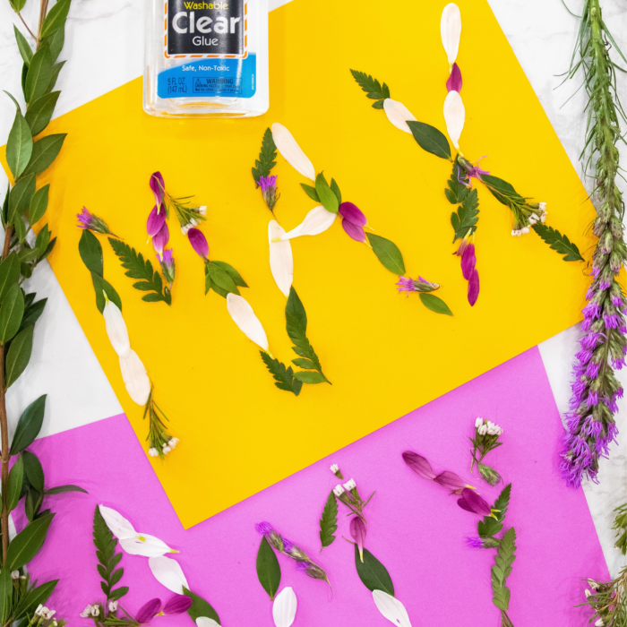 Nature name art for kids is a fun way to use items from the outdoors to make their name stand out. A DIY activity for kids they will enjoy. #DIY #activity #name #art #outdoors #forkids #flowers #grass #project #cheap #affordable flower artwork for kids