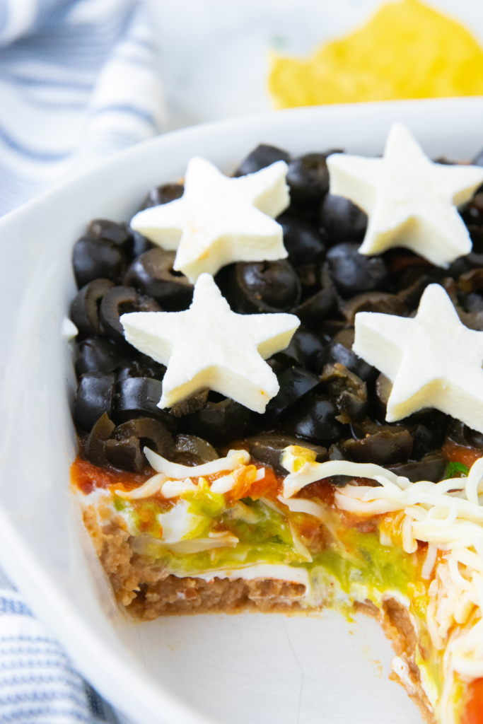 cut taken out of a layered sauce to see the dip