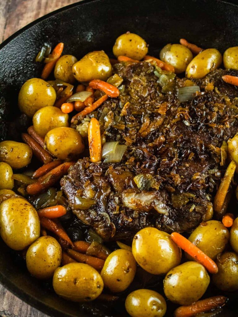 pot roast in a cast iron skillet