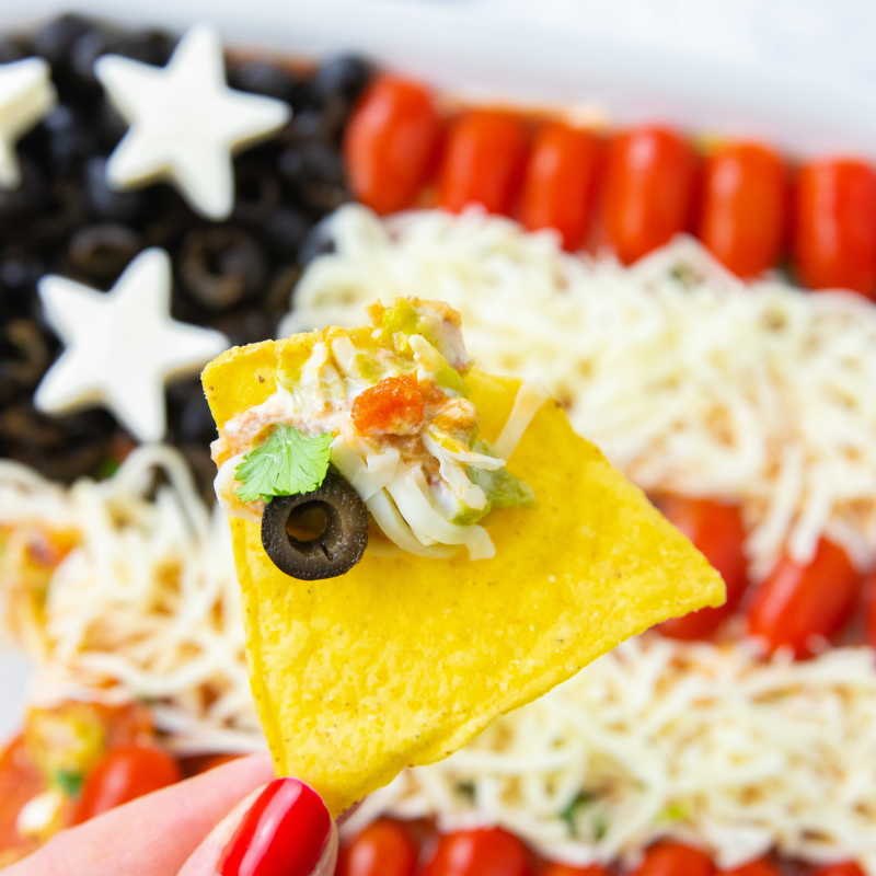 chip with taco dip on it 