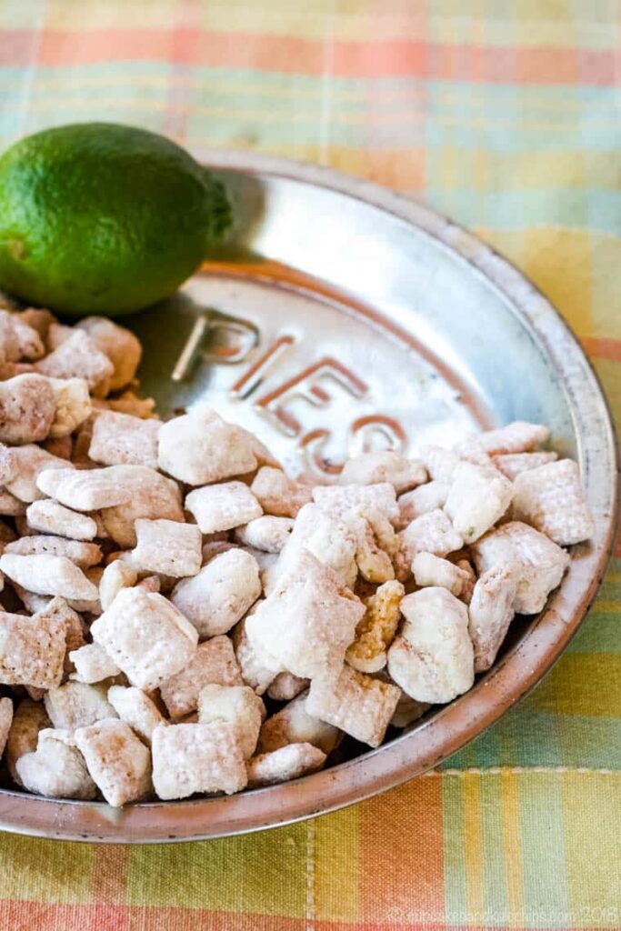 key lime puppy chow in a pie plate on table 
