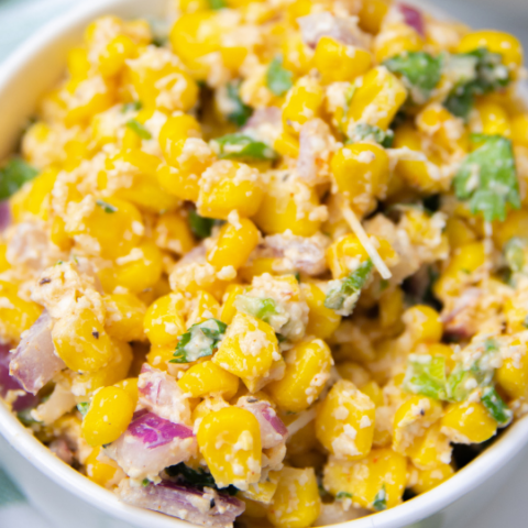 street corn salad in a white bowl