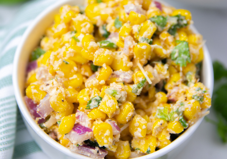 street corn salad in a white bowl