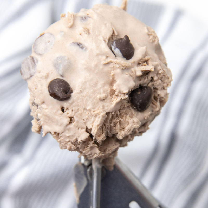 Keto Mason Jar Chocolate Ice Cream is a simple and delicious creamy ice cream recipe. A sugar free keto approved ice cream recipe. #icecream #keto #passion4savings #monkfruit #sugarfree #heavycream #chocolate #dessert #easy scoop of ice cream on ice cream scoop