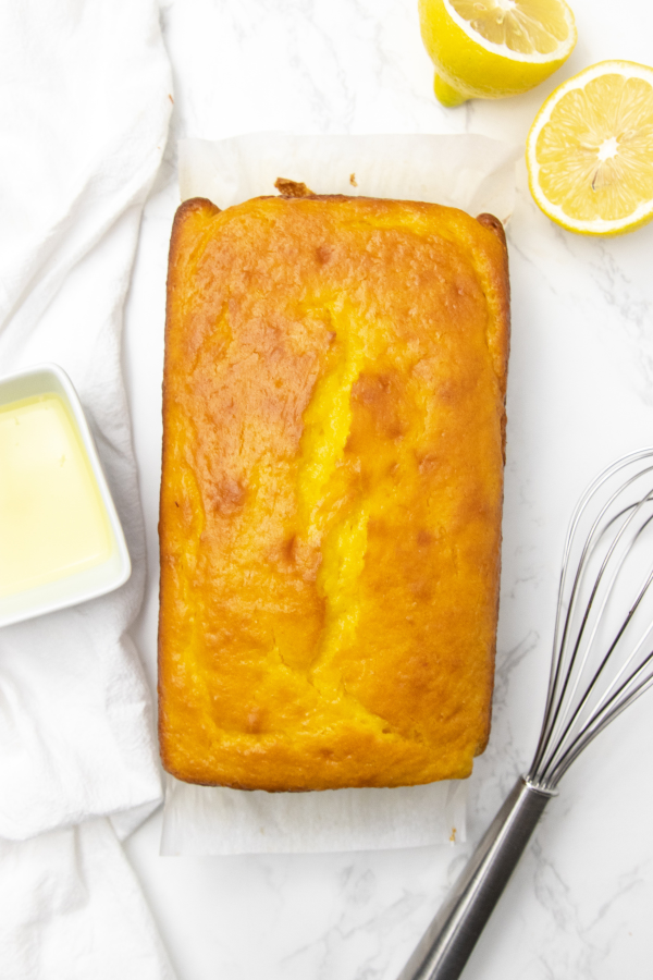Starbucks copycat lemon bread is a delicious lemon bread with a homemade 2 ingredient lemon glaze. A Starbucks recipe to make at home. #passion4savings #lemon #bread #lemonloaf #lemonbread #lemonglaze #starbucks #copycat #recipe loaf of lemon bread on counter