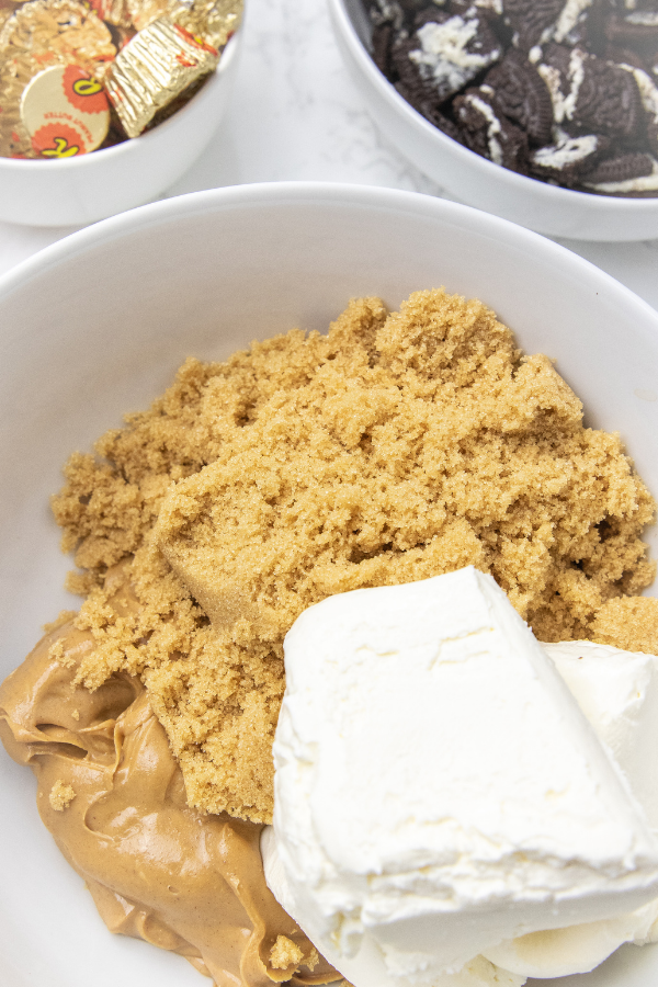 brown sugar, peanut butter and cream cheese in a bowl 
